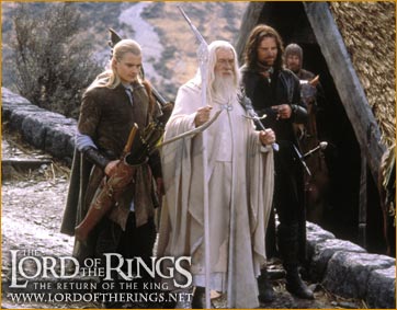 Legolas and Aragorn escort Gandalf to the stables